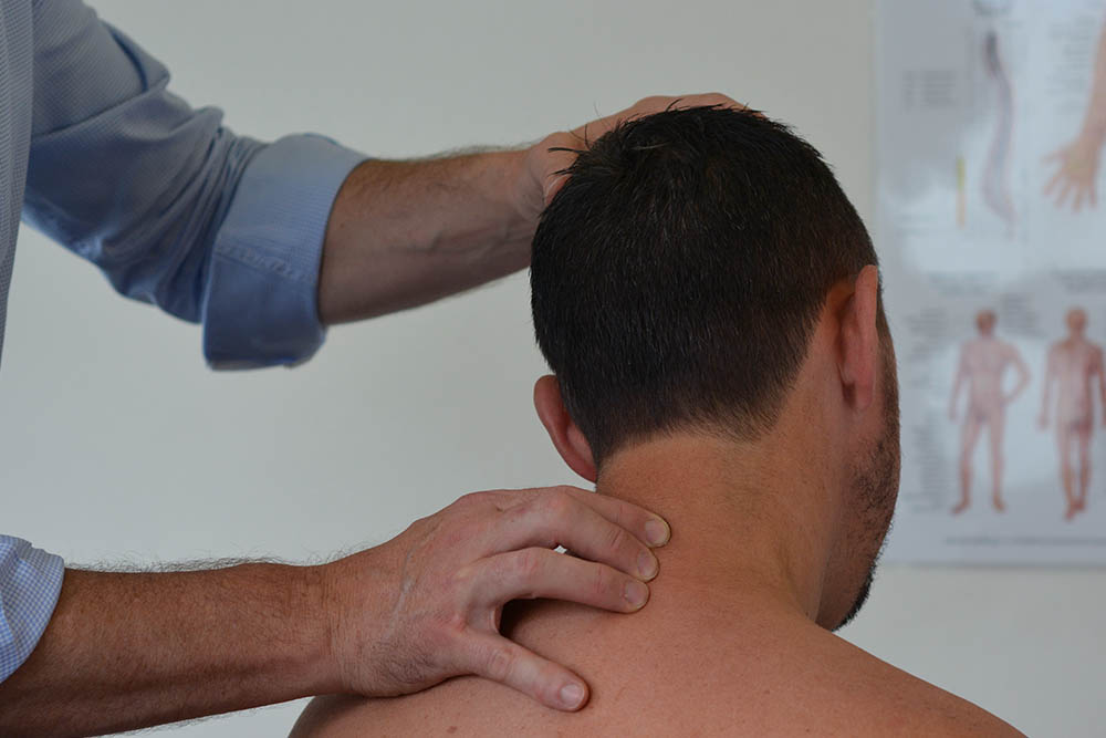 S adjusting D neck - Walters Chiropractic Parramatta